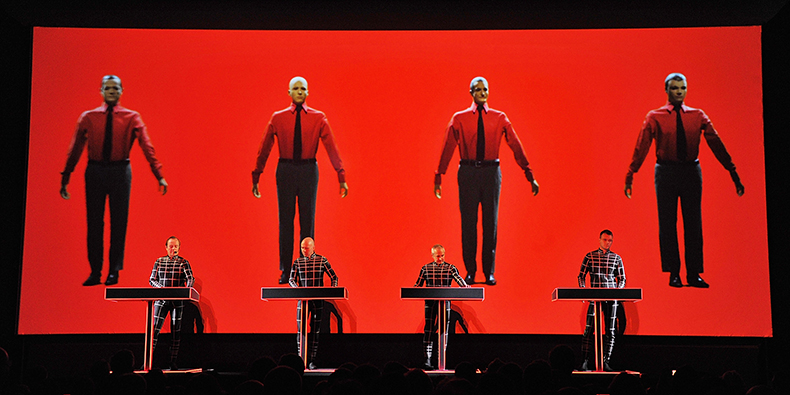 NEW YORK, NY - APRIL 10: (L-R) Ralf Hütter, Henning Schmitz, Fritz Hilpert, and Stefan Pfaffe of the band Kraftwerk perform during the Kraftwerk - Retrospective 1 2 3 4 5 6 7 8, Autobahn (1974) at The Museum of Modern Art on April 10, 2012 in New York City. (Photo by Mike Coppola/Getty Images)